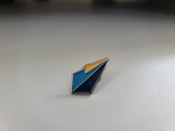 Metal pin of 17th Shard logo with colored enamel