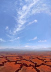 Blue Sky Over the Shattered Plains